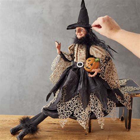 Sitting witch halloween decoration with mechanical features